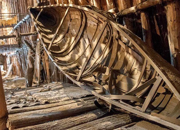Interior of a wooden boat hull frame under construction inside a timber workshop SSG.